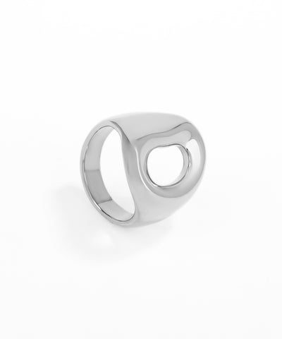 Silver ring with a circular design on a white background