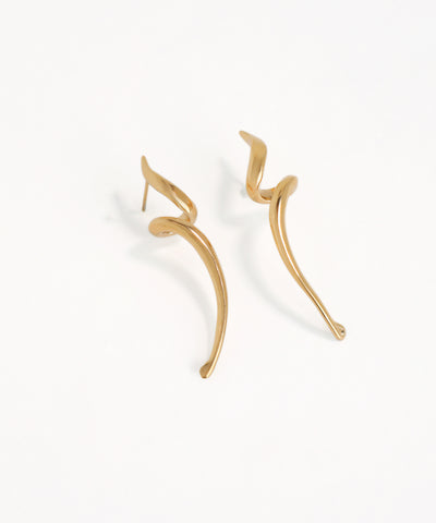 Gold earrings wavy drop on a white background