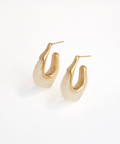 Pair of gold hoop earrings on a white background