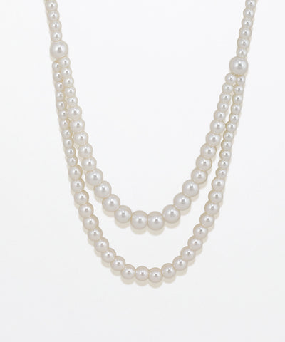 Two-layered pearl necklace on a white background