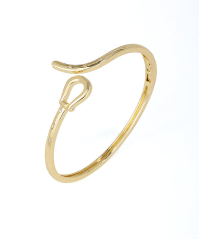 Gold ring with a unique design on a white background