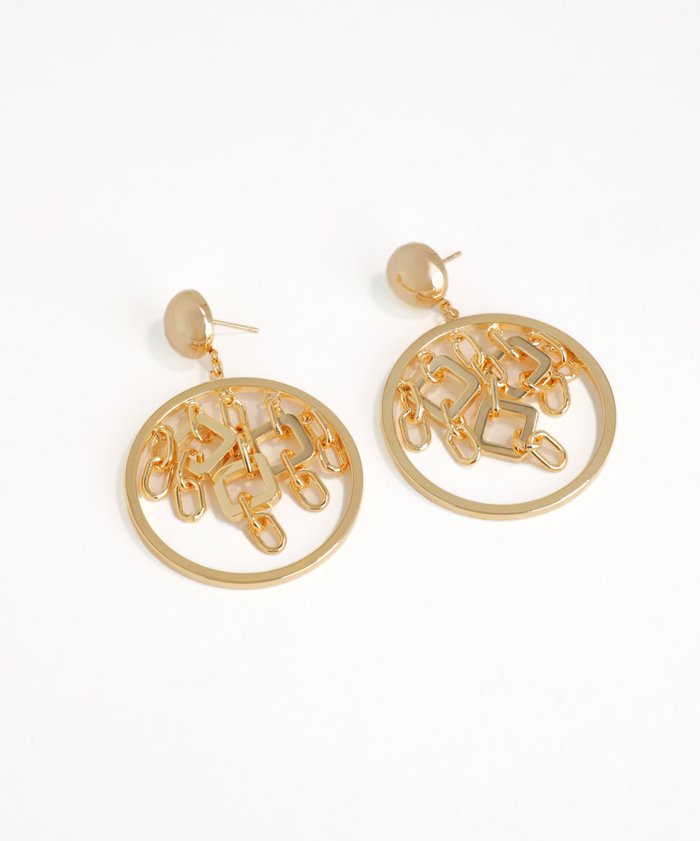 Gold circular earrings on a white background