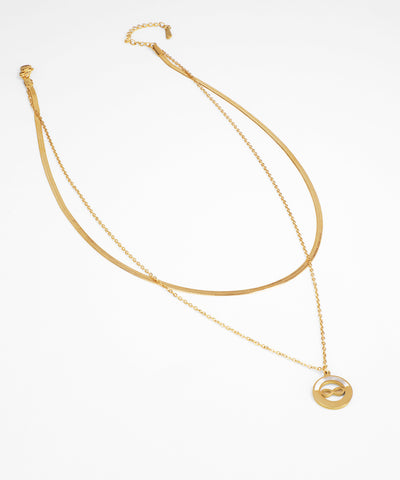 Gold necklace with a pendant on a white background
