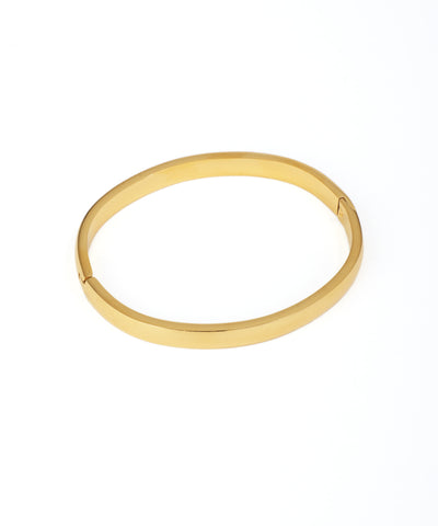 Gold bangle on a white background