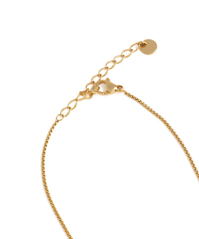 Gold bracelet on a white background