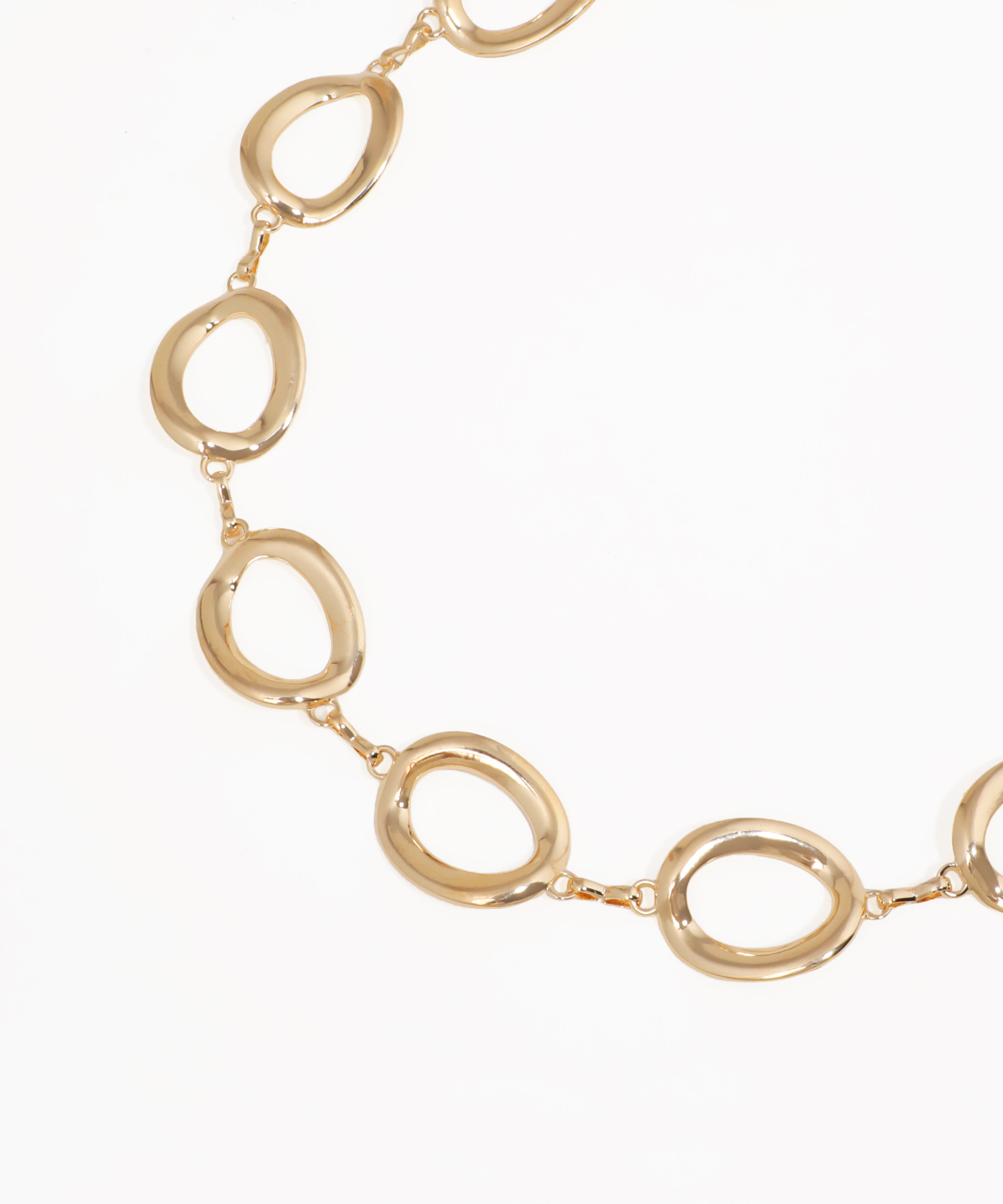 Gold necklace with interlocking oval links on a white background