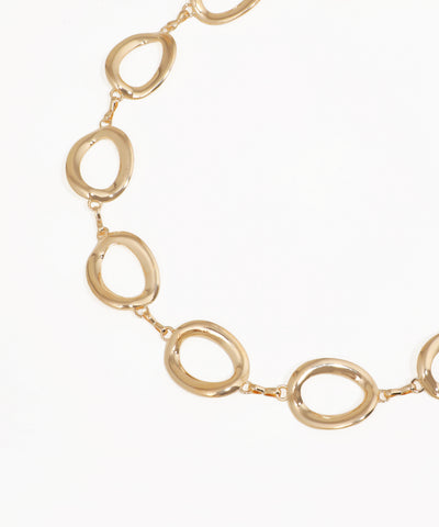 Gold necklace with interlocking oval links on a white background