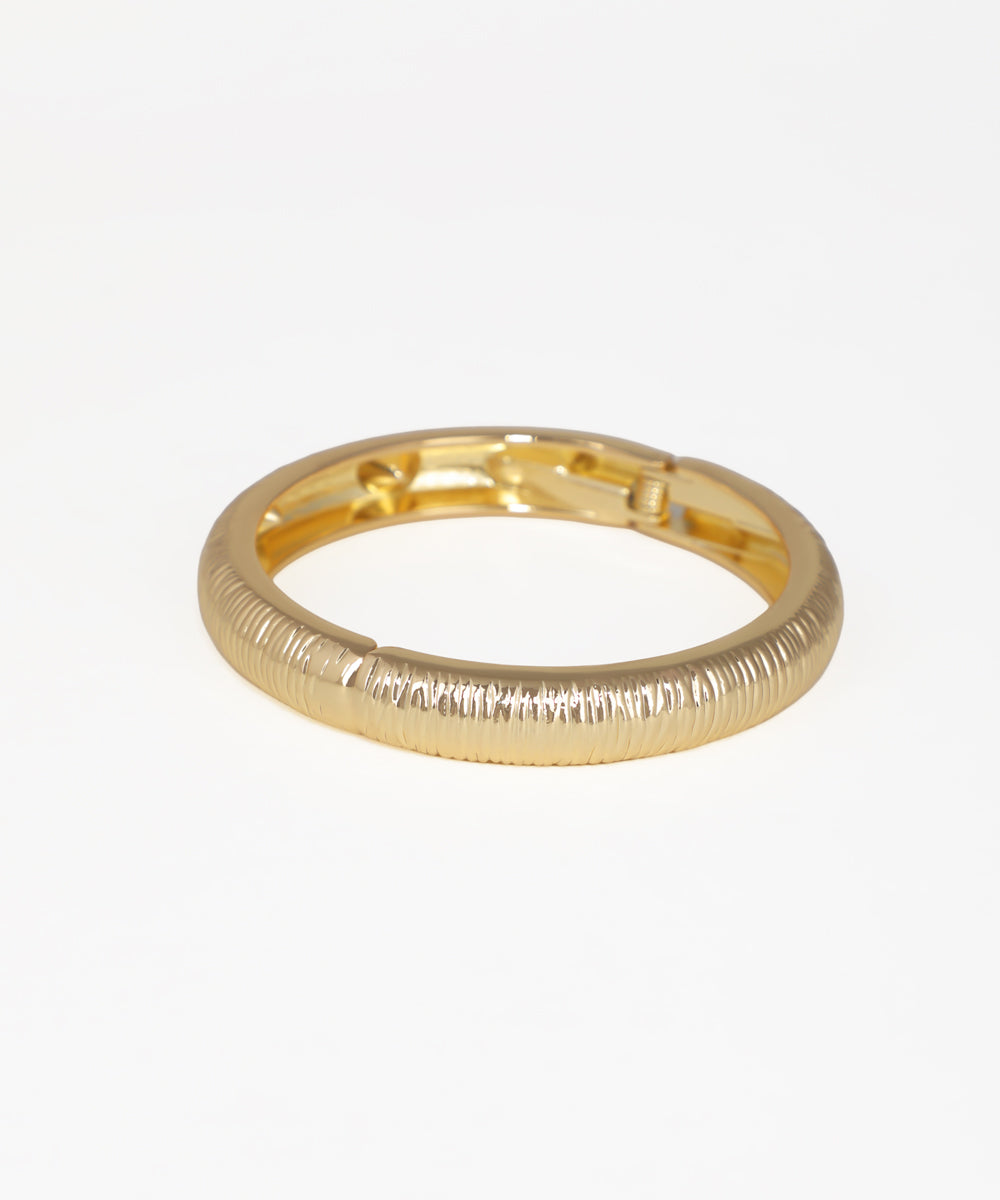 Gold-tone bangle kada with ribbed texture and hinged closure