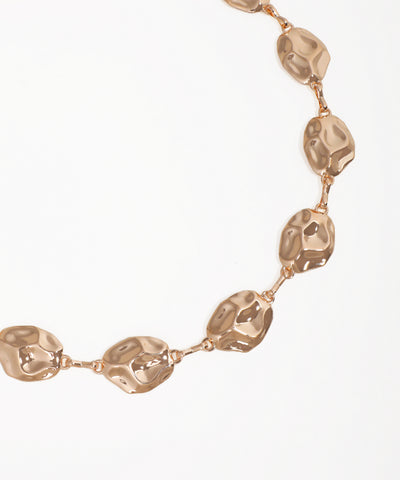 Rose gold necklace on a white background