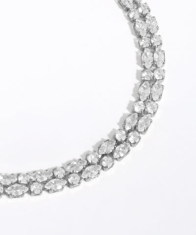 Diamond necklace on a light gray background