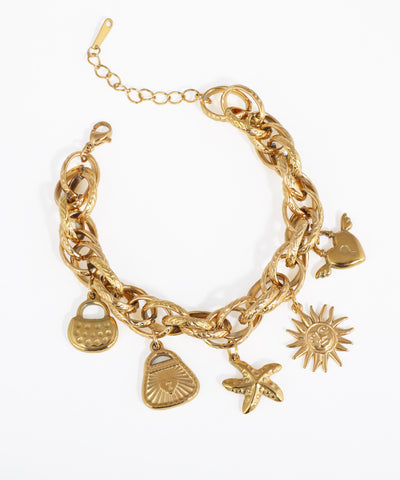 Gold-tone bracelet with chunky textured links and an assortment of whimsical charms like a sun, starfish, and heart.