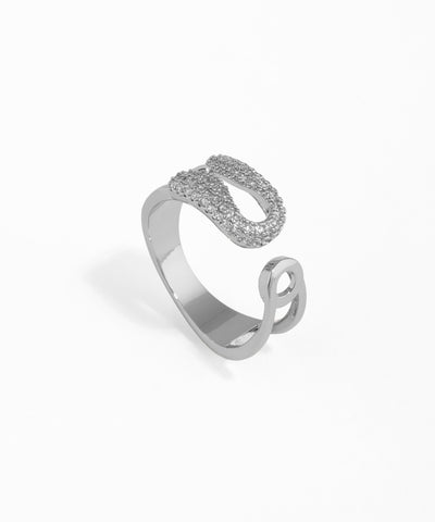 Silver open ring with intricate design on a white background