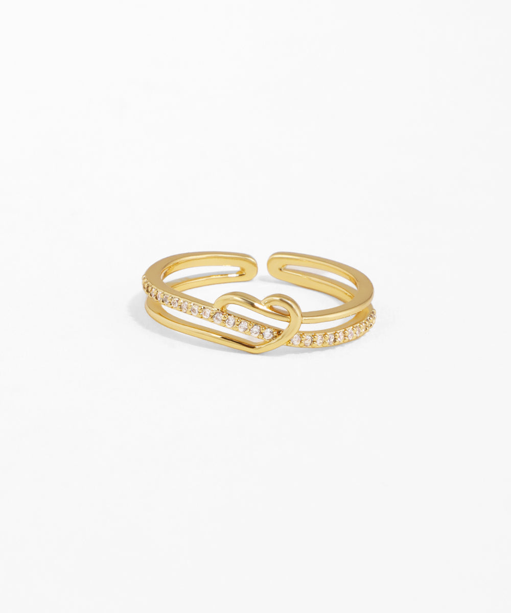 Gold ring with a diamond lock design on a white background