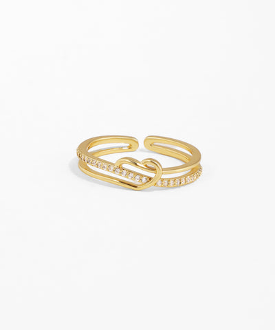 Gold ring with a diamond lock design on a white background