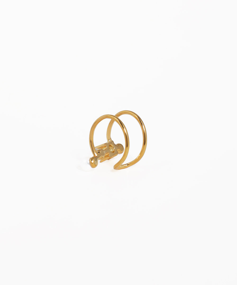 Gold earring on a white background
