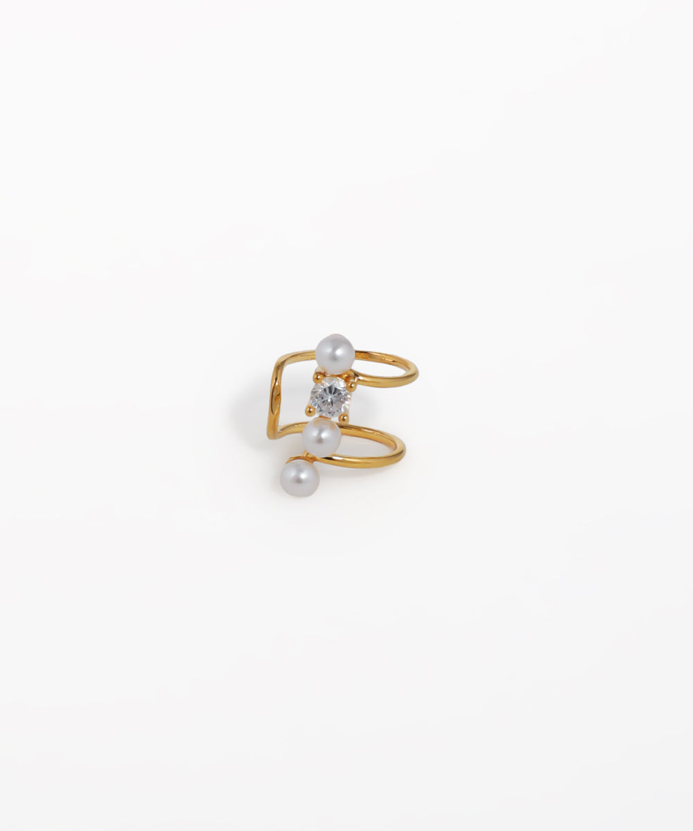 Gold-tone ear cuff with spiral design, featuring one clear CZ stone and two faux pearls.