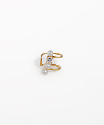Gold-tone ear cuff with spiral design, featuring one clear CZ stone and two faux pearls.