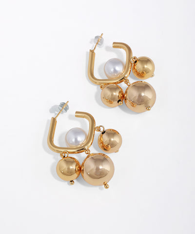 Gold-tone earrings with square hoops featuring faux pearls and polished sphere drops