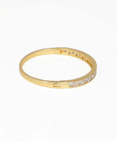 Gold ring with small diamonds on a white background
