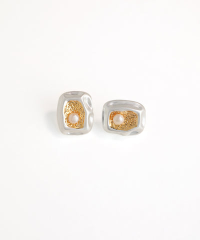 Pair of silver and gold earrings on a white background