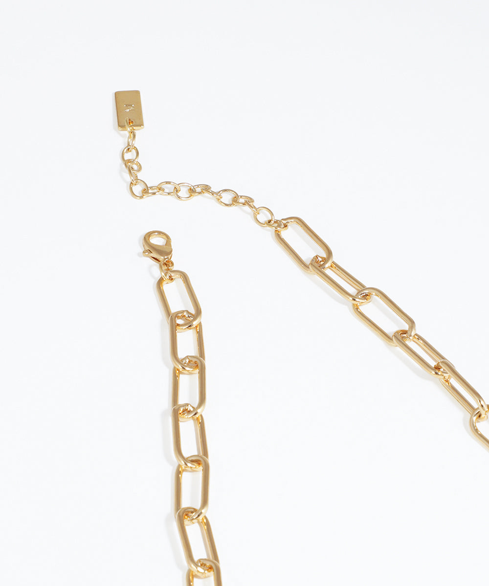 Gold chain necklace on a white background