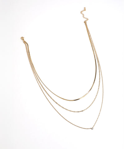Gold necklace on a white background
