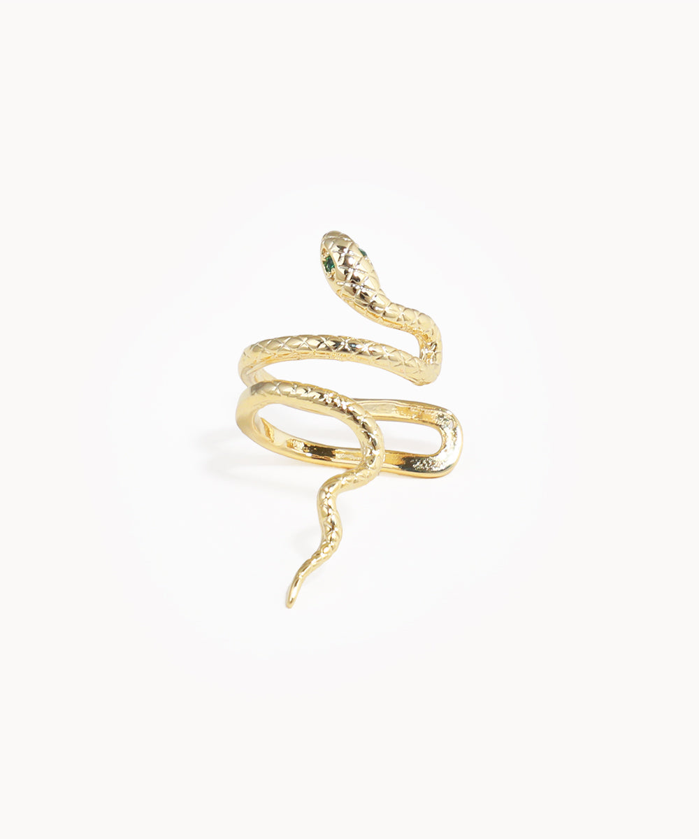 Gold-tone ear cuff with coiled serpent design and green eye details