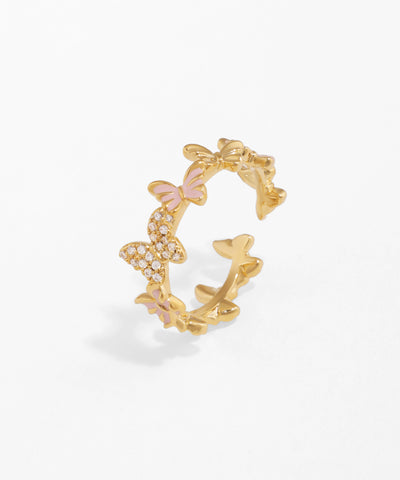Gold-tone ring with sparkling CZ butterflies and pink enamel accents