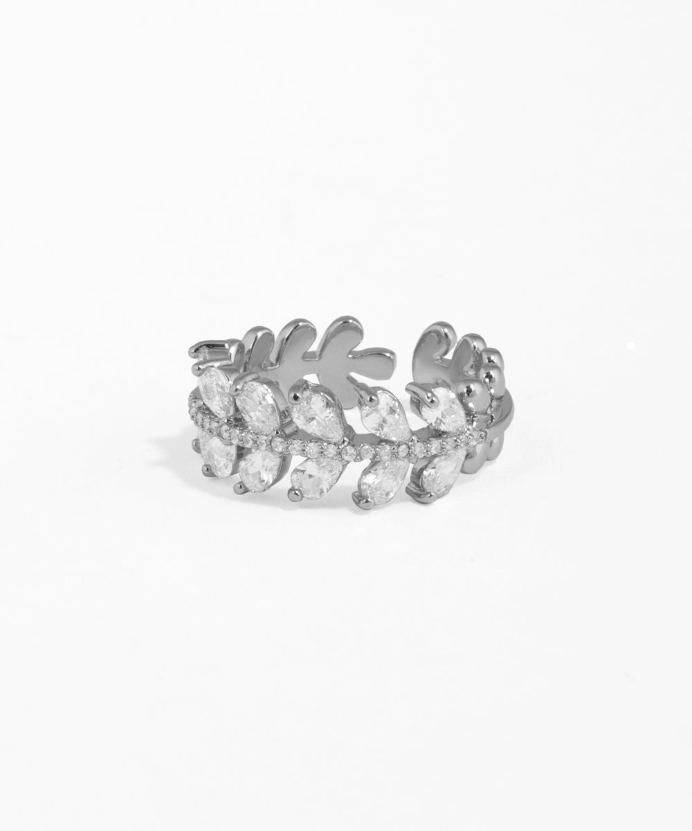 Silver ring with leaf design on a white background