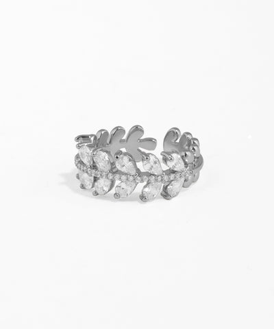 Silver ring with leaf design on a white background