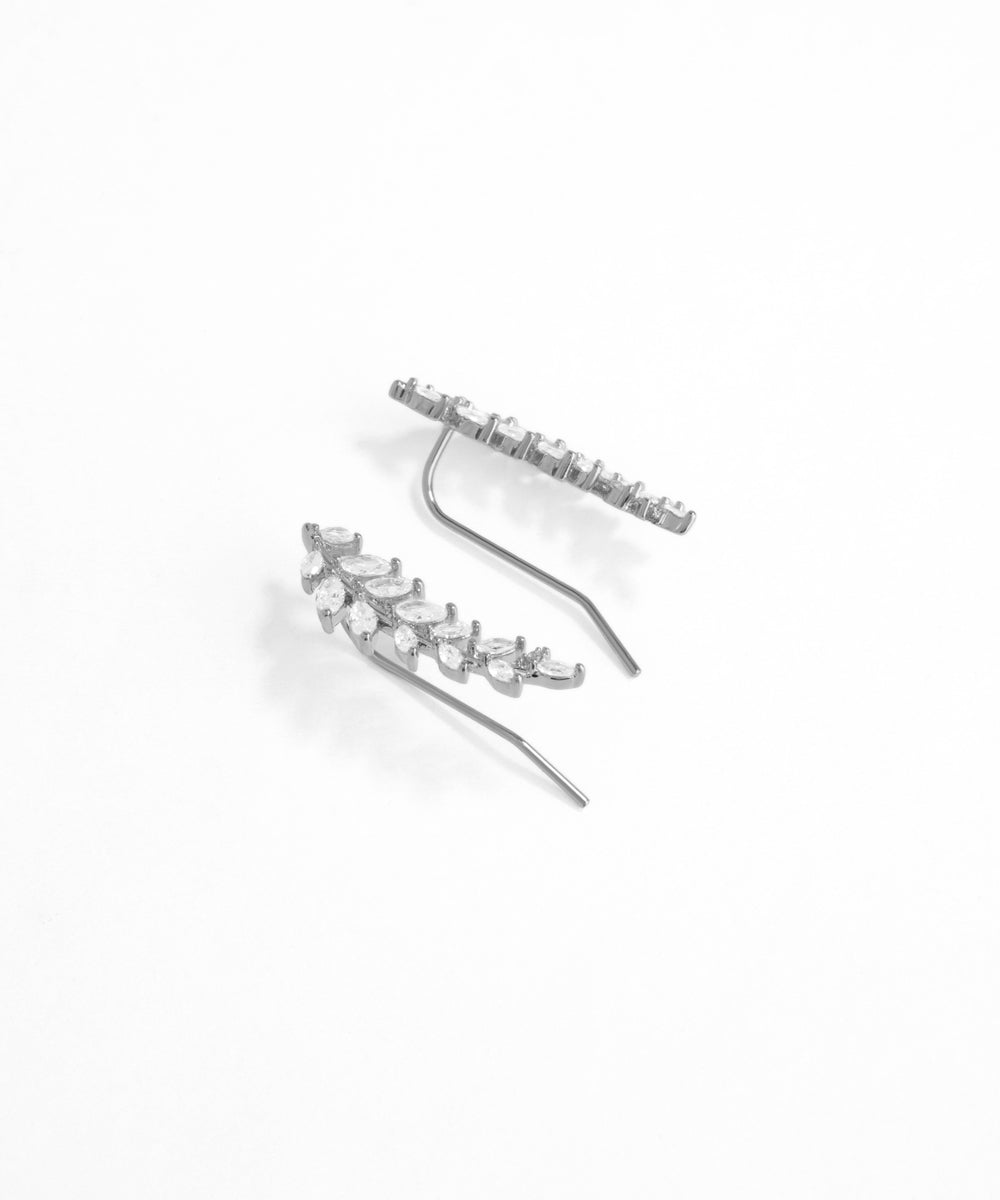 Silver hair clip with small stones on a white background