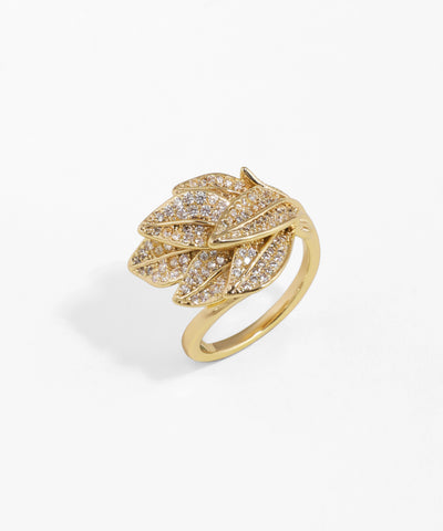 Gold ring with leaf design and embedded diamonds on a white background