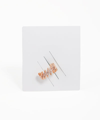 Rose gold ring with gemstones on a white background