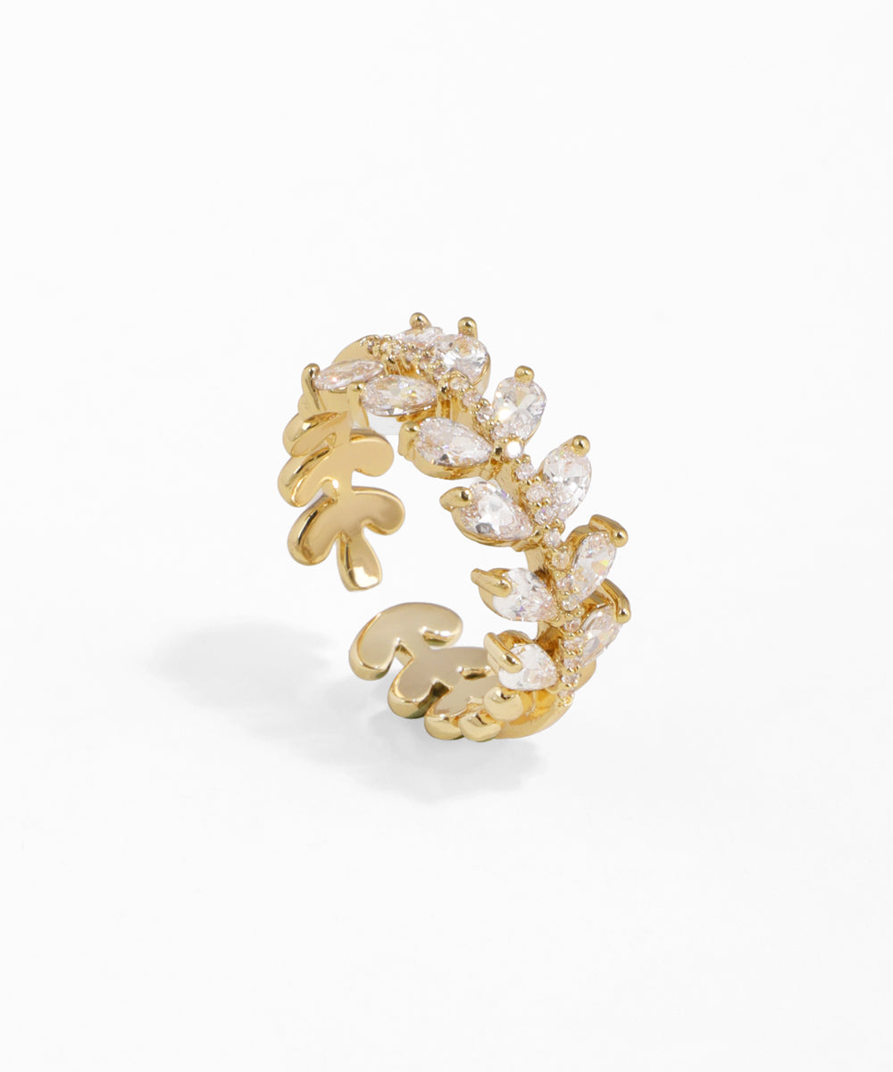 Gold-tone open ring with sparkling CZ stones arranged in a delicate leaf and branch motif