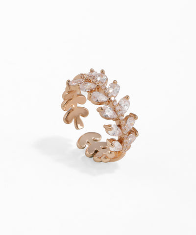 Rose gold ring with diamond accents on a white background