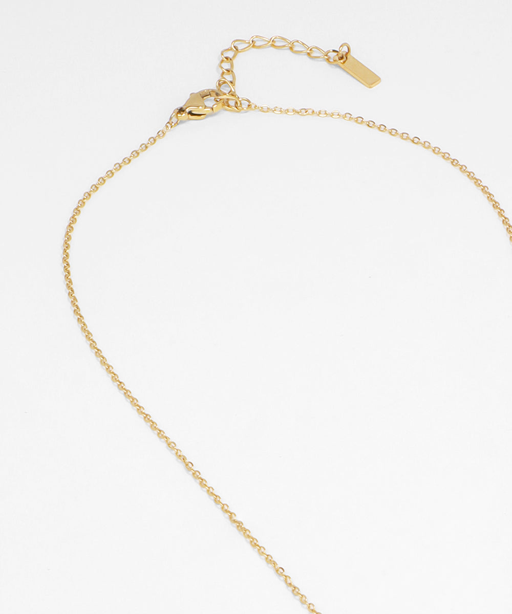 Gold chain necklace on a white background