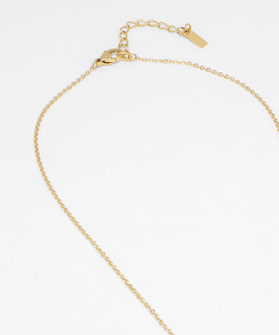 Gold chain necklace on a white background