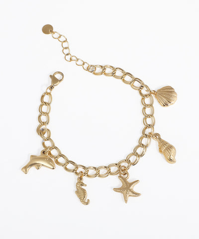 Gold-tone bracelet with sea creature charms including dolphin, seahorse, starfish, and shells