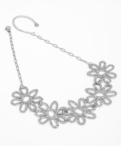 Silver floral necklace on a white background
