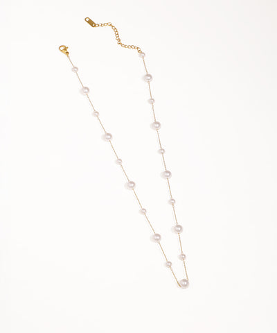 Gold-tone chain necklace with graduated faux pearls