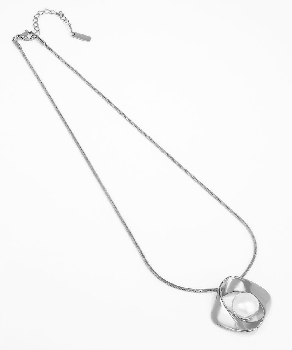 Silver necklace with a unique pendant on a white background