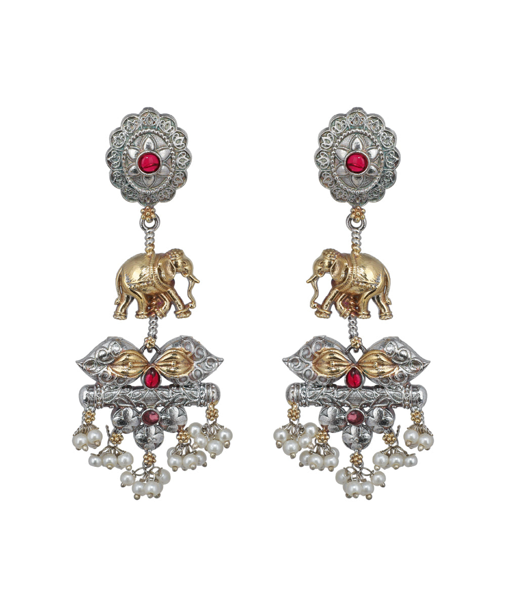 Ornate earrings with elephants, pearls, and red stones on a white background