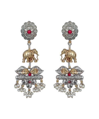 Ornate earrings with elephants, pearls, and red stones on a white background