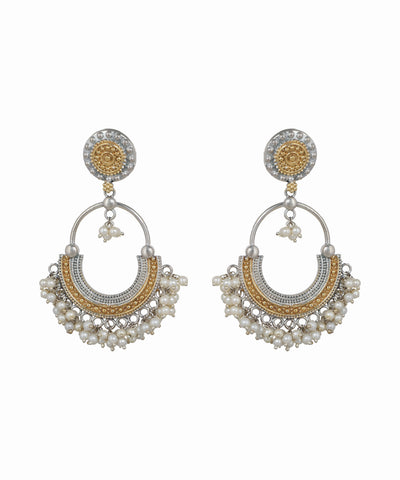 Pair of gold and silver earrings with pearl accents on a white background