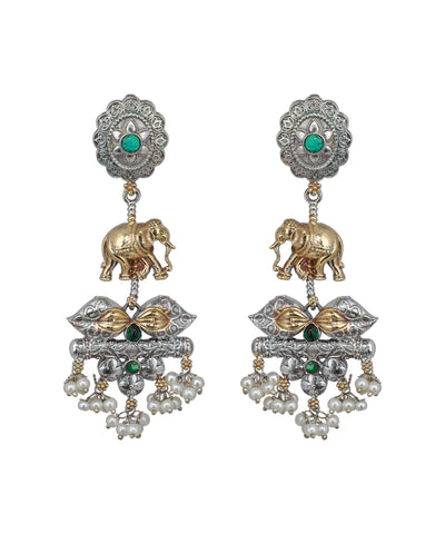 Ornate earrings with elephants, pearls, and green stones on a white background