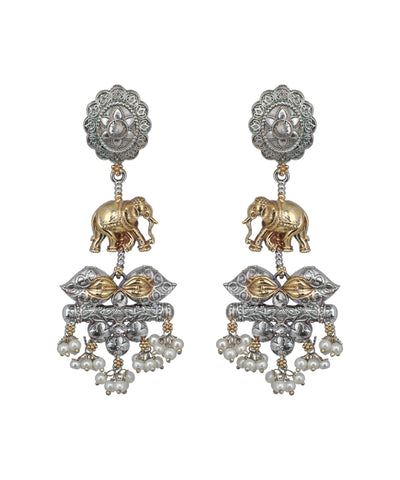 Ornate earrings with elephants and pearl-like beads on a white background