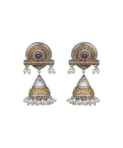 Pair of ornate earrings with gold and silver design on a white background