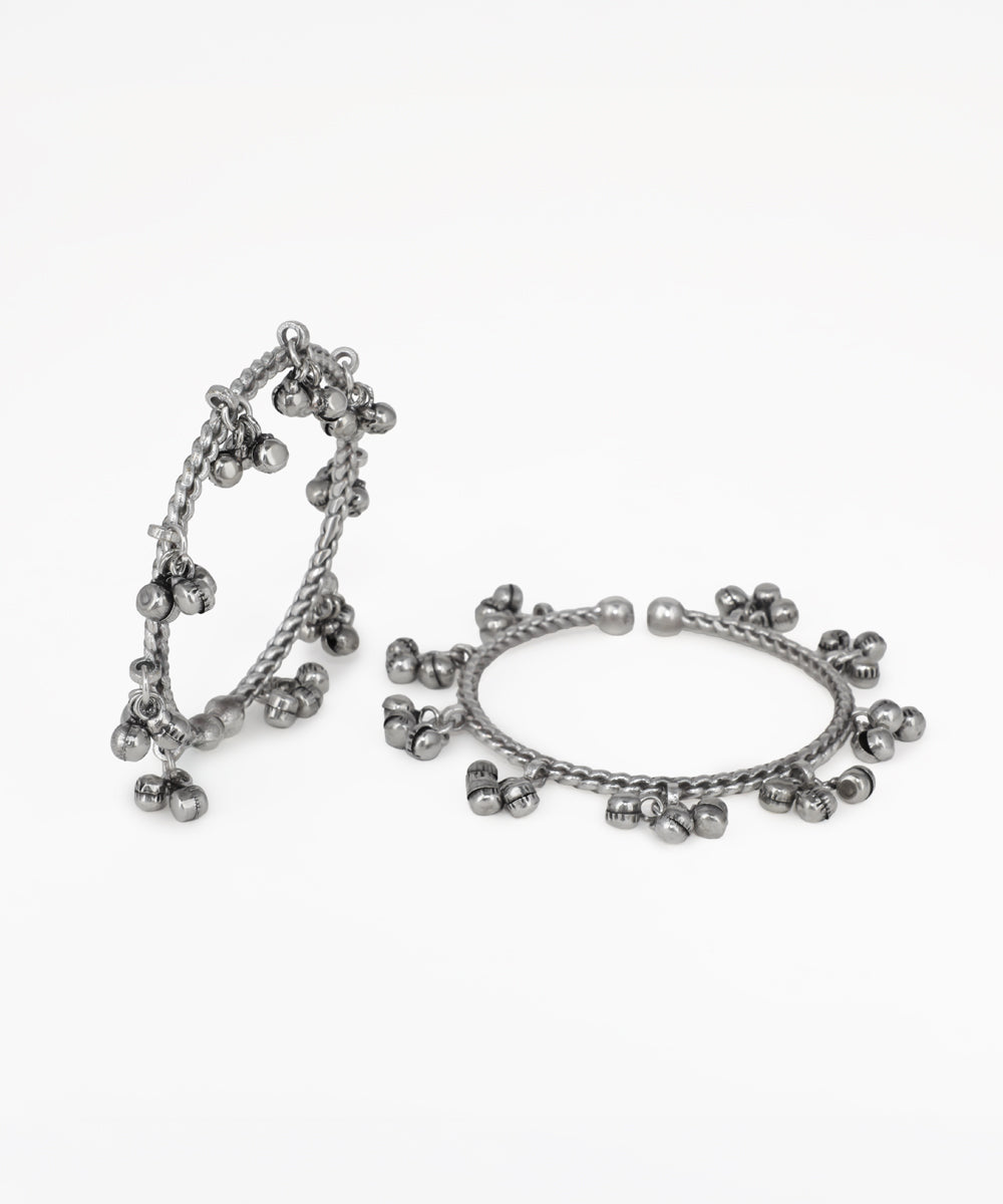 Pair of silver hoop earrings on a white background