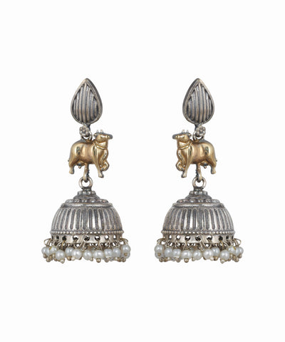 Pair of silver and gold earrings with pearl accents on a white background