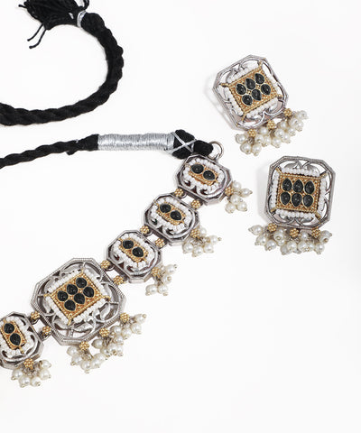 Jewelry set with necklace and earrings on a white background